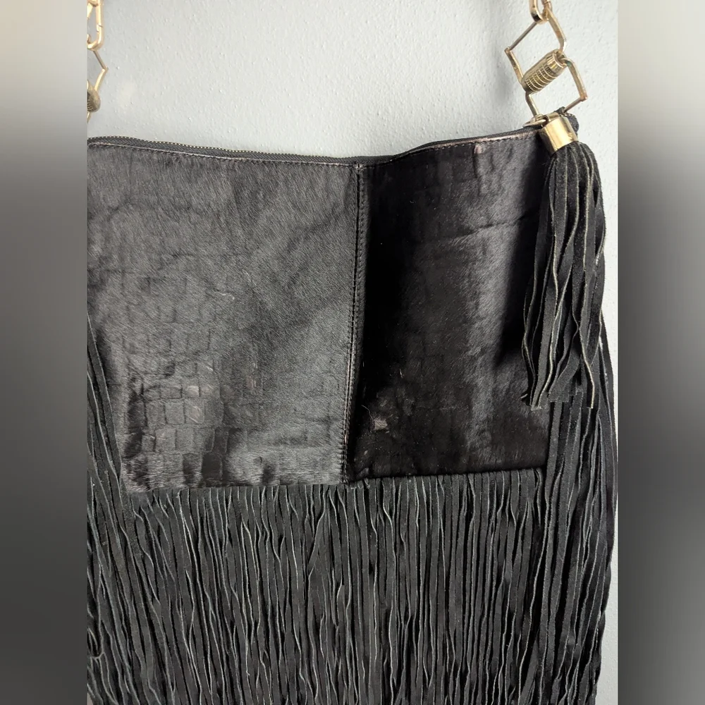Black leather Fringe crossbody bag feels like cow leather. No tags. No brand tag